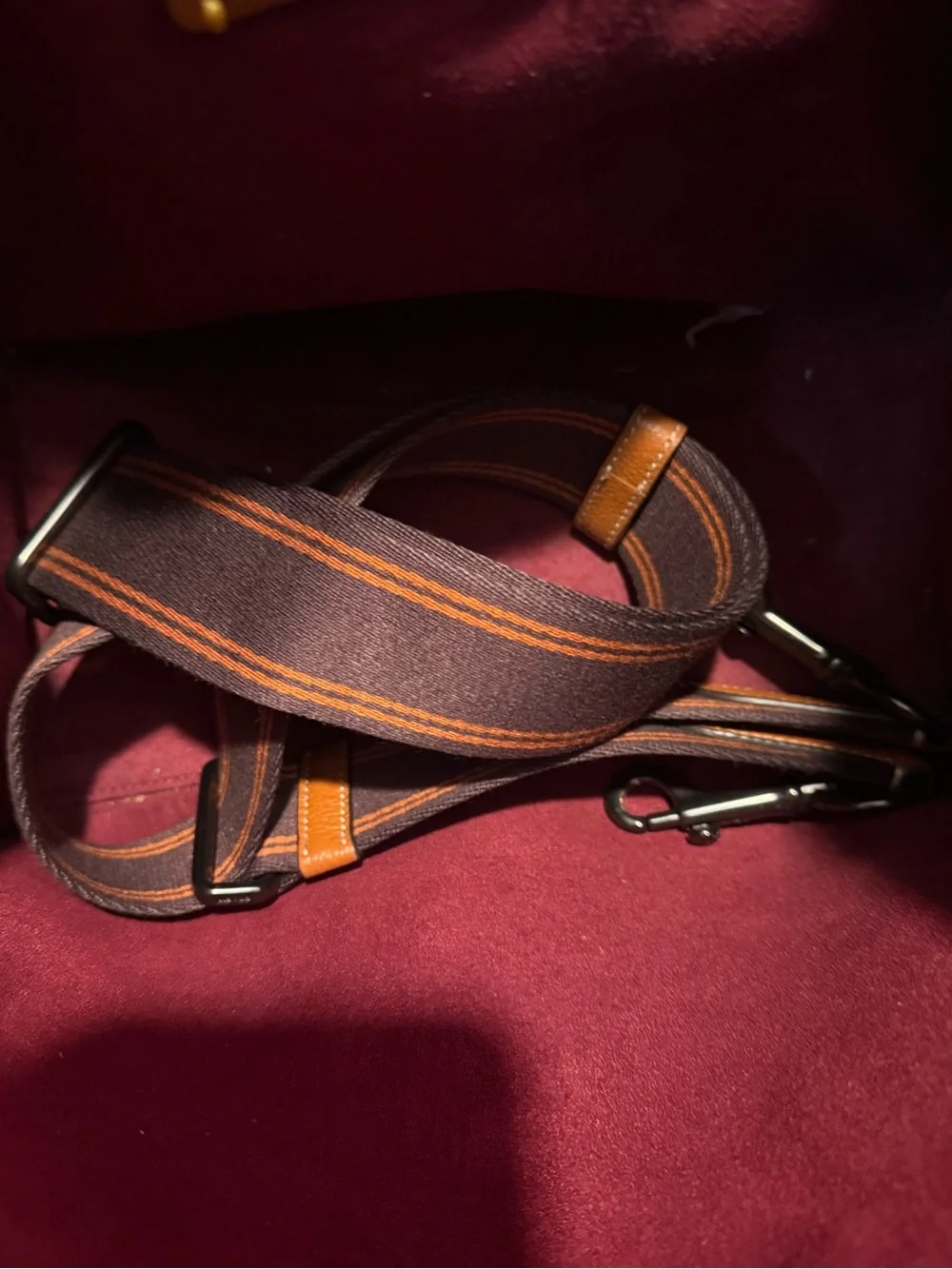 This is a Coach Field Tote in Truffle Black with a horse and carriage print